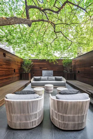 a view of outdoor sitting area with furniture