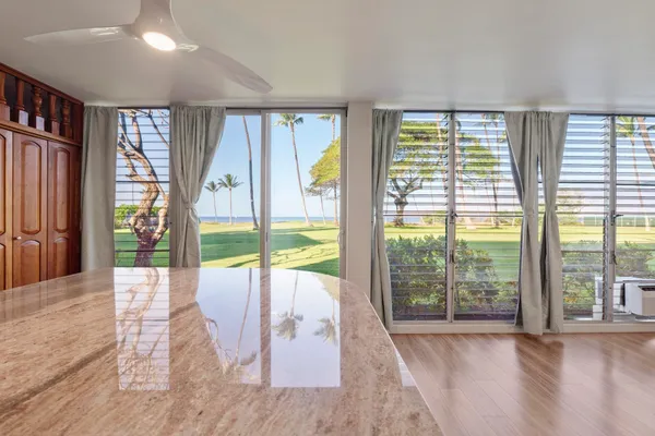 a view of an entryway with wooden floor