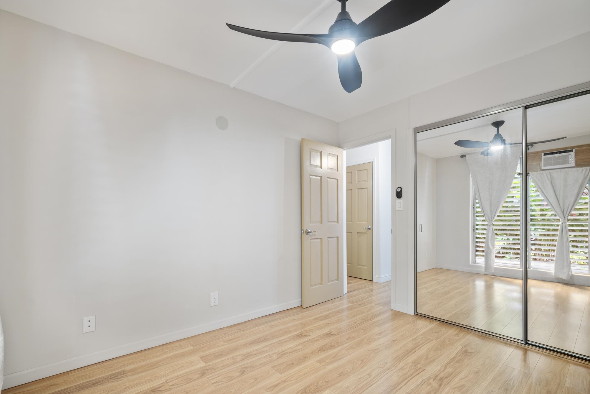1002 South Kihei Road, Unit 114 Kihei, HI 96753 - Photo 26 of 50 wooden floor in an empty room with a window