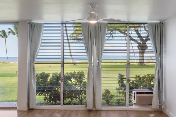 a view of a room that has a large window