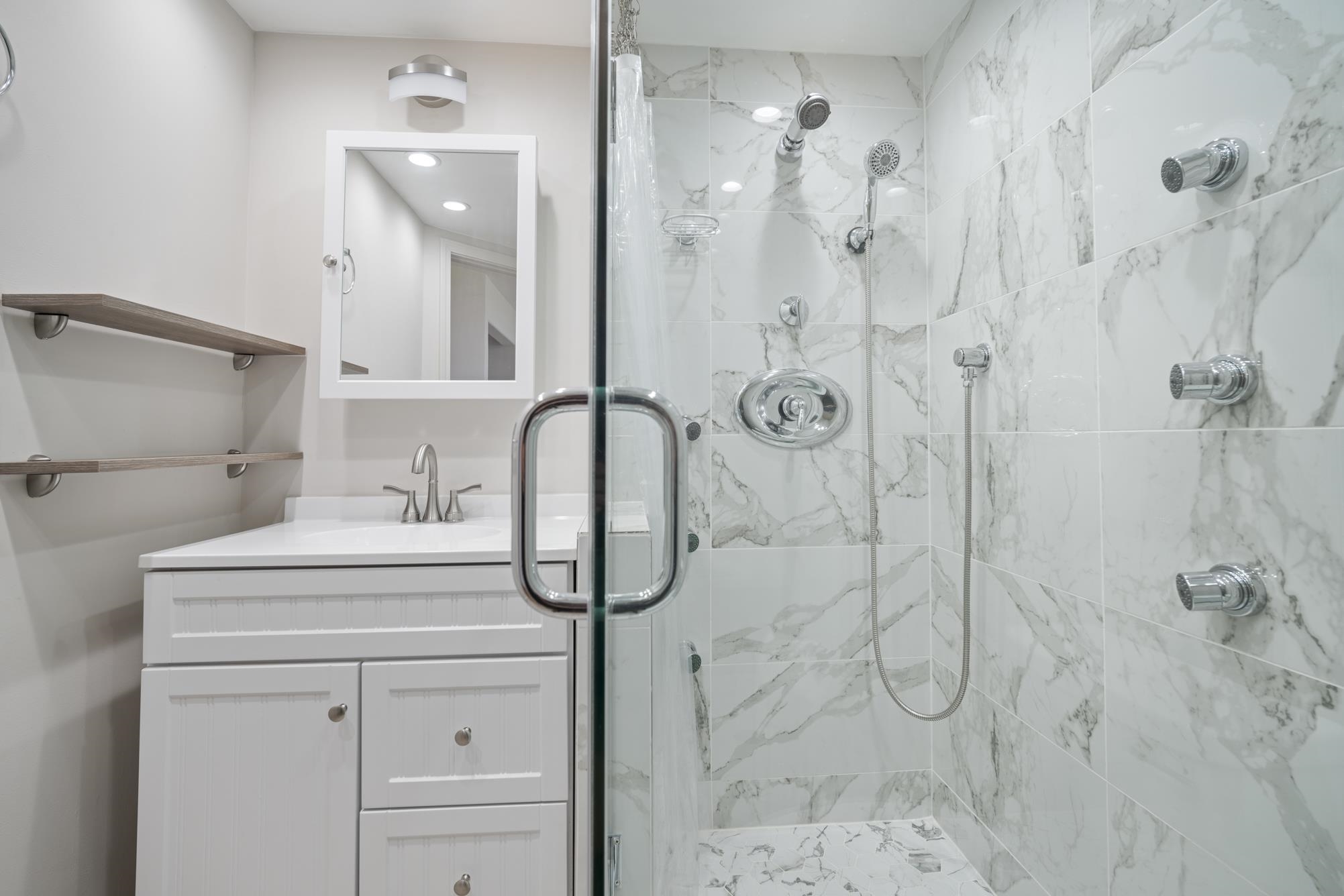 1002 South Kihei Road, Unit 114 Kihei, HI 96753 - Photo 30 of 50 a bathroom with a sink a toilet and shower