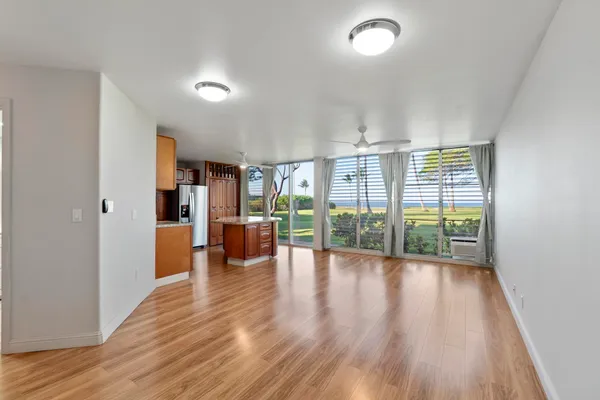 a view of an entryway with wooden floor
