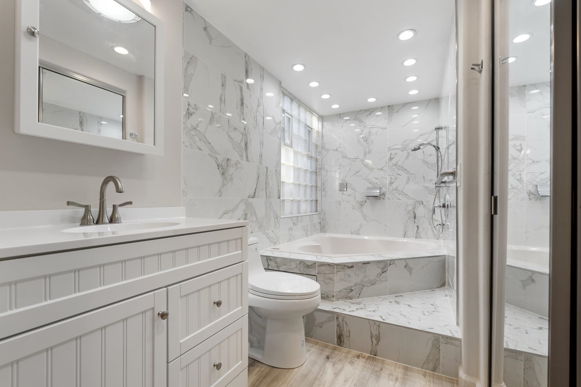 1002 South Kihei Road, Unit 114 Kihei, HI 96753 - Photo 32 of 50 a bathroom with a bathtub shower sink mirror and toilet