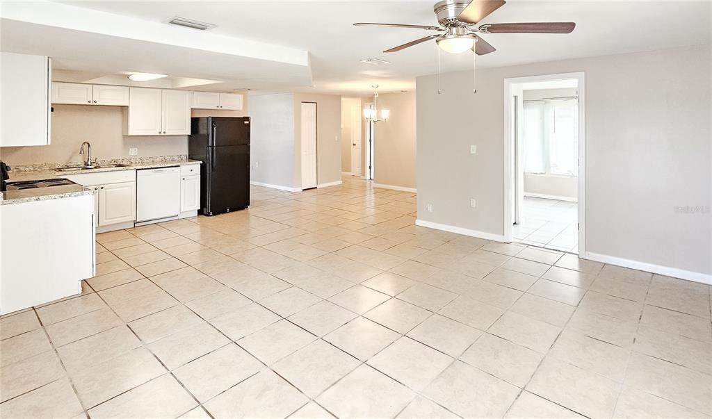 7304 Embassy Boulevard Port Richey, FL 34668 - Photo 7 of 14 a view of kitchen with furniture and refrigerator