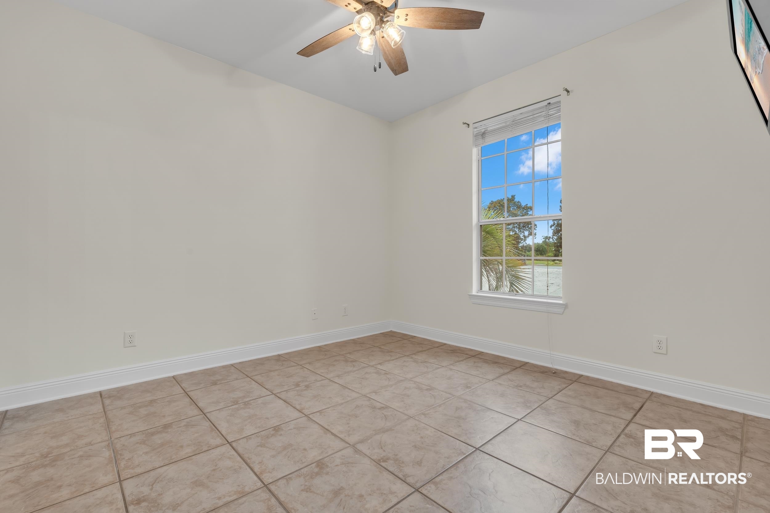 4606 Osprey Drive Orange Beach, AL 36561 - Photo 35 of 44 Guest bedroom number 2, featuring a ceiling fan and light tile patterned floors