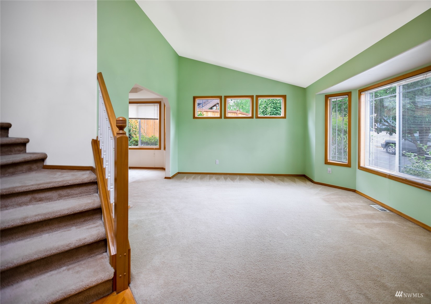 414 170th Place Southeast Bothell, WA 98012 - Photo 3 of 40 a view of an empty room with wooden floor and stairs
