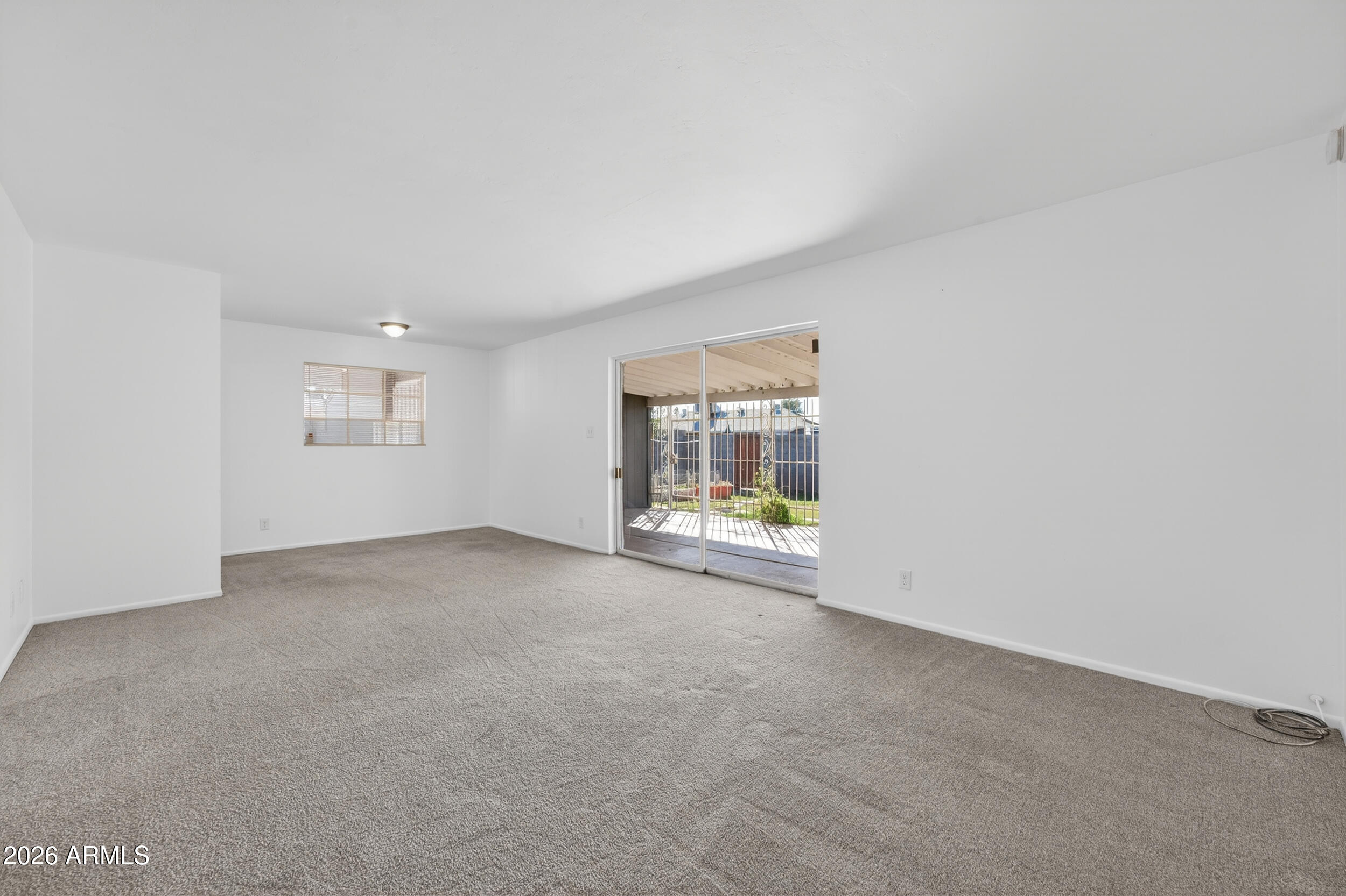2233 West Flower Street Phoenix, AZ 85015 - Photo 12 of 36 a view of an empty room with a window