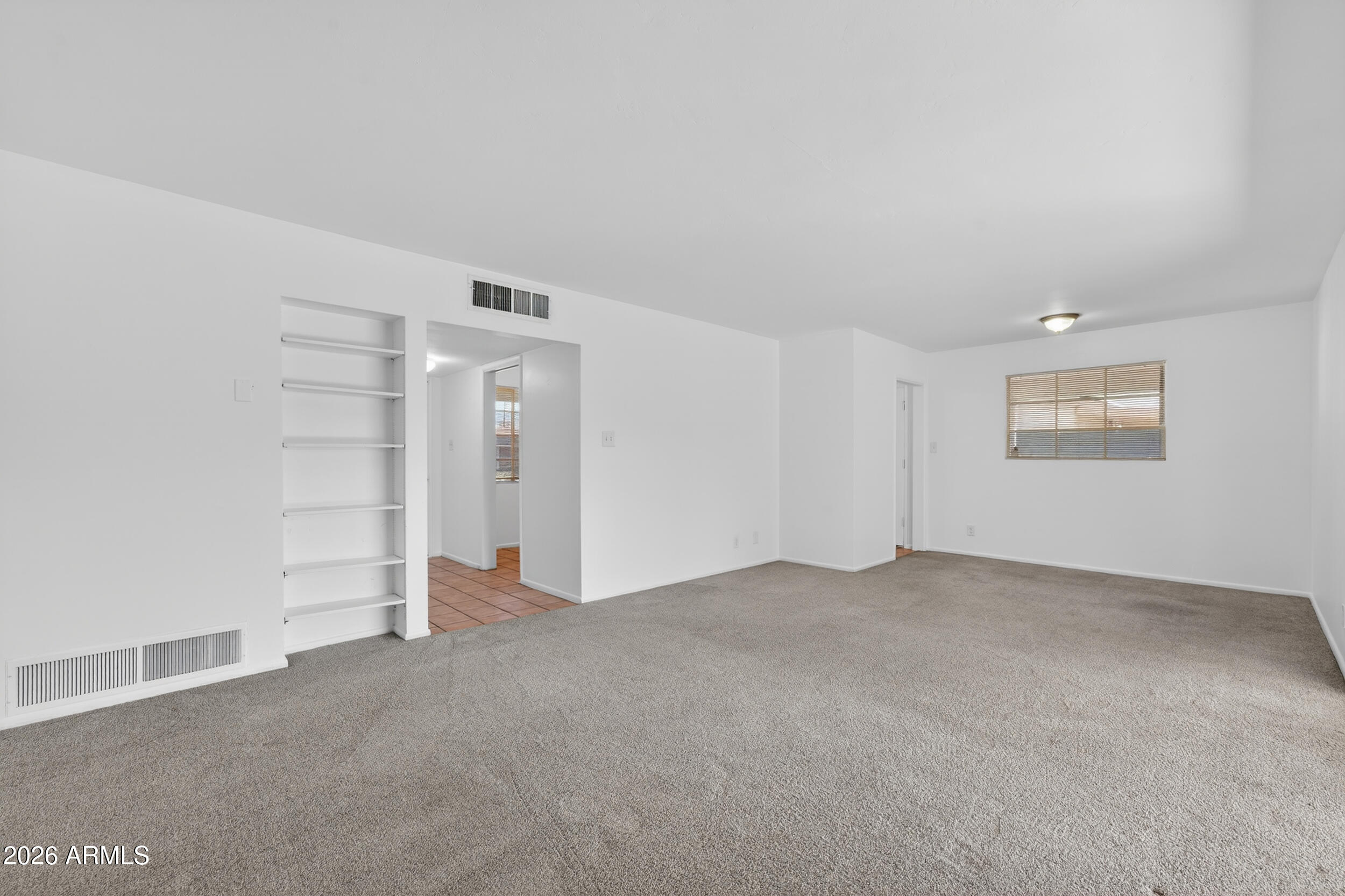 2233 West Flower Street Phoenix, AZ 85015 - Photo 13 of 36 an empty room with closet area