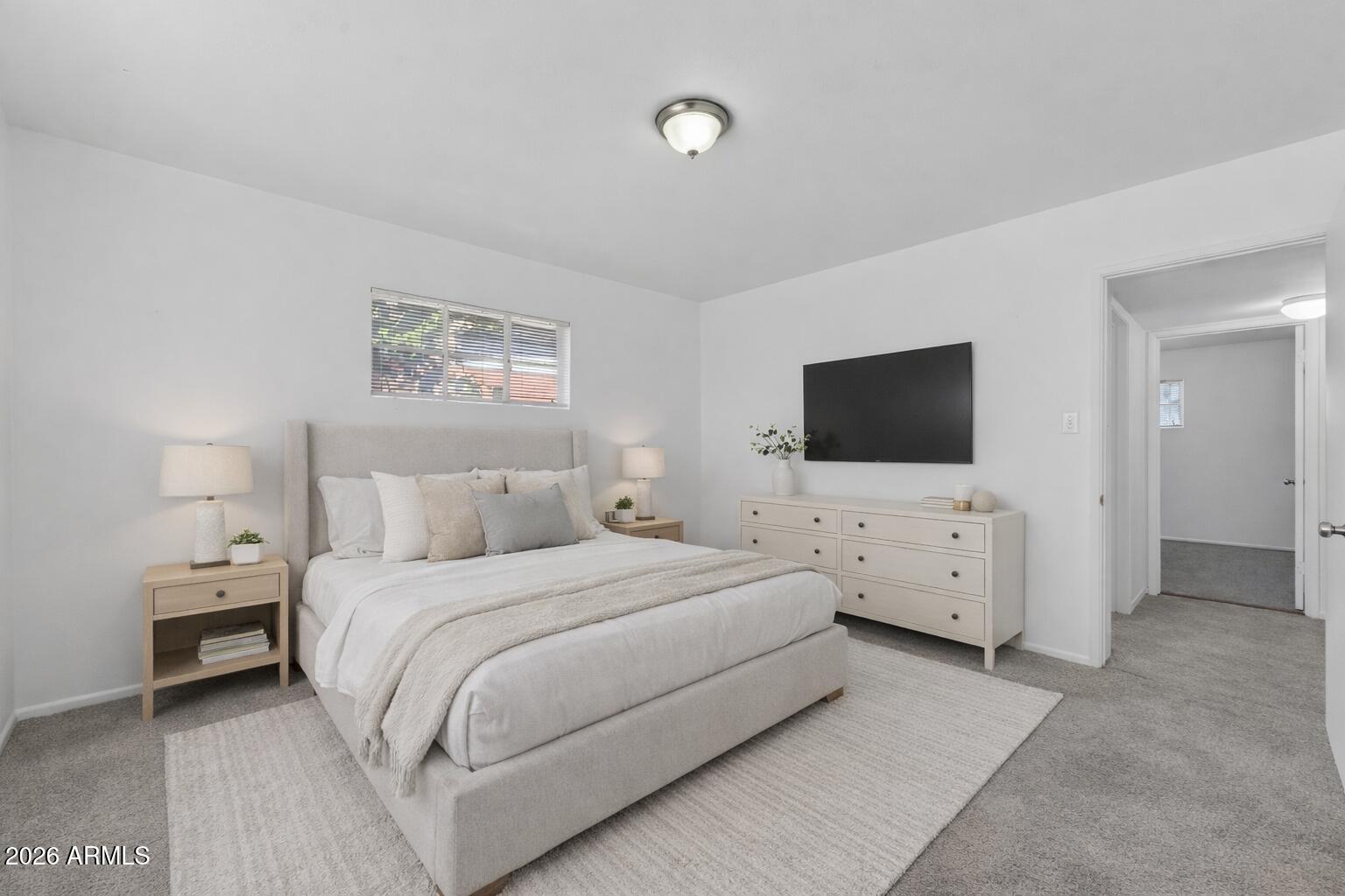 2233 West Flower Street Phoenix, AZ 85015 - Photo 21 of 36 a bedroom with bed tv and window