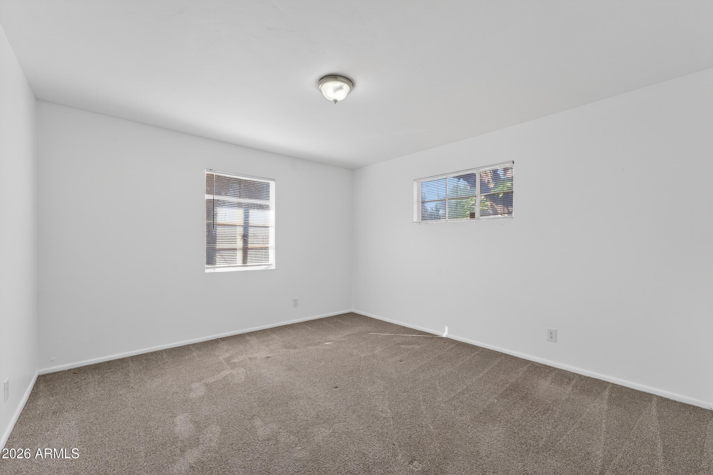 2233 West Flower Street Phoenix, AZ 85015 - Photo 22 of 36 an empty room with windows