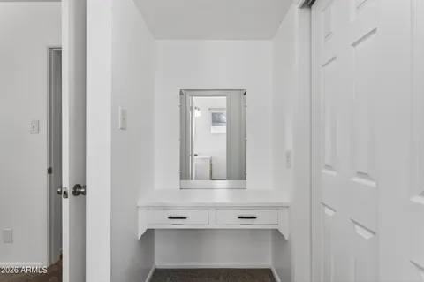 a view of front door with wooden door