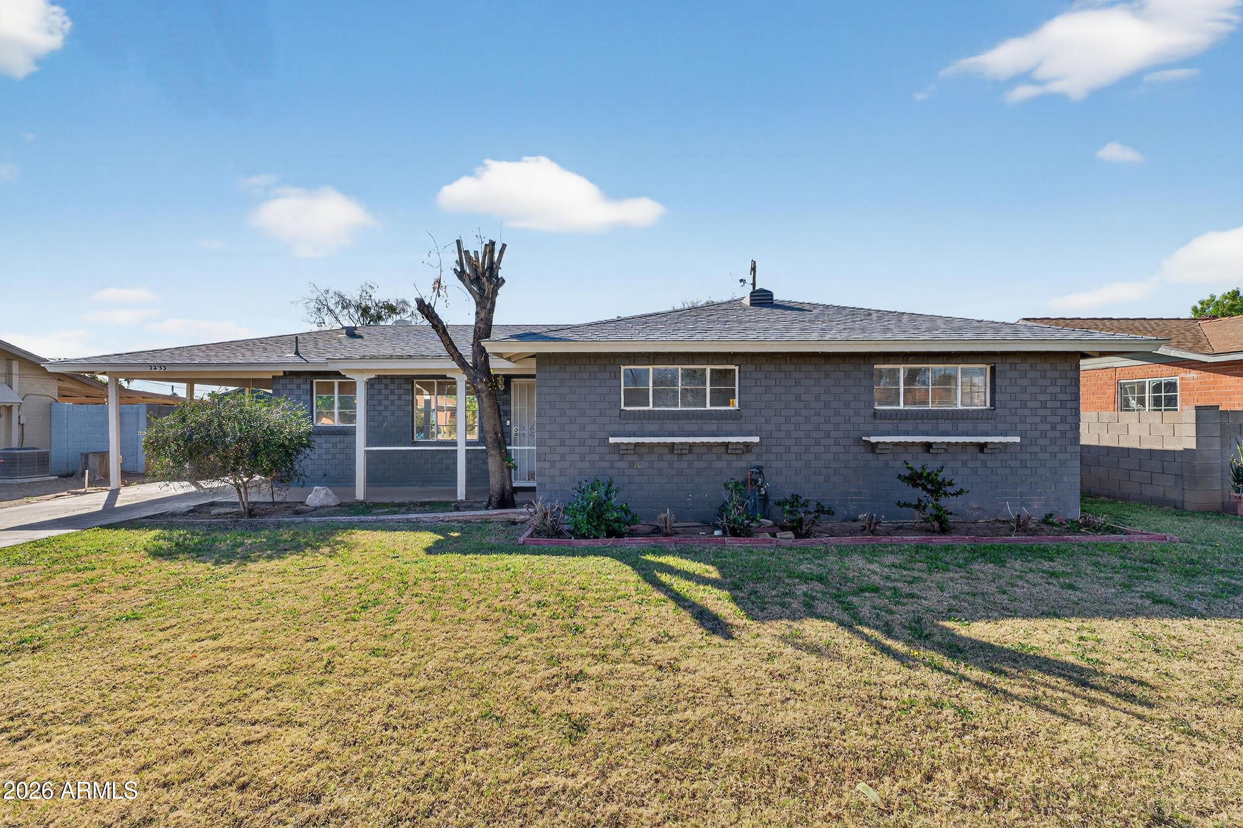 2233 West Flower Street Phoenix, AZ 85015 - Photo 2 of 36 a view of a house with swimming pool and a yard