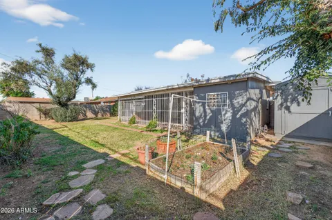 a view of a house with a yard and garage