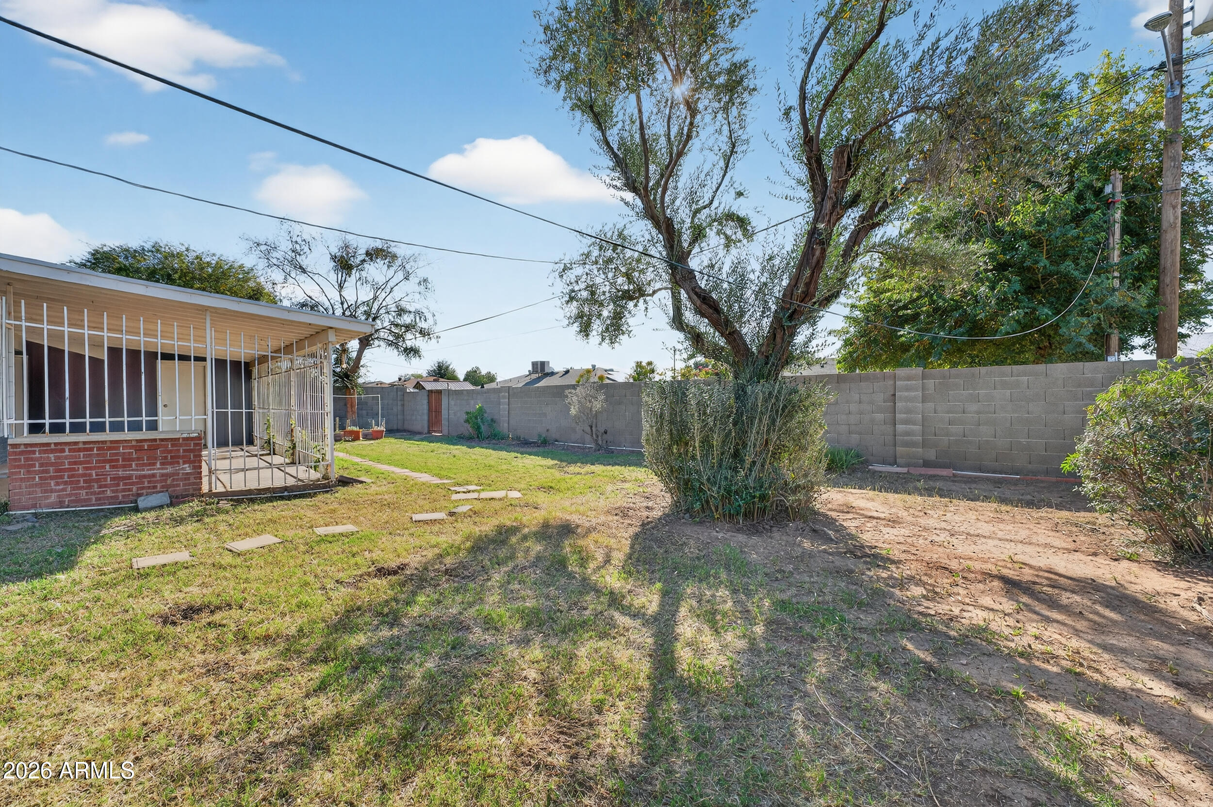 2233 West Flower Street Phoenix, AZ 85015 - Photo 32 of 36 a view of a house with backyard and tree