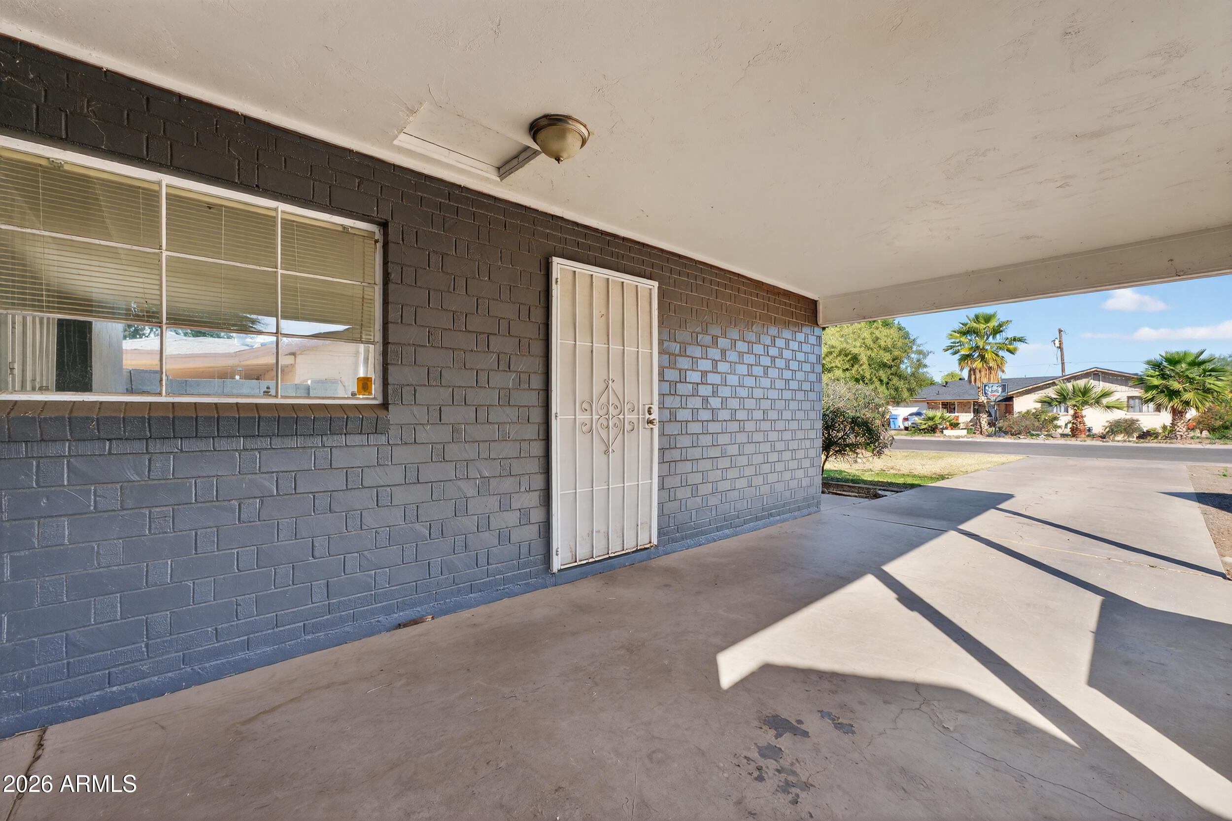 2233 West Flower Street Phoenix, AZ 85015 - Photo 5 of 36 a view of an empty room and a window