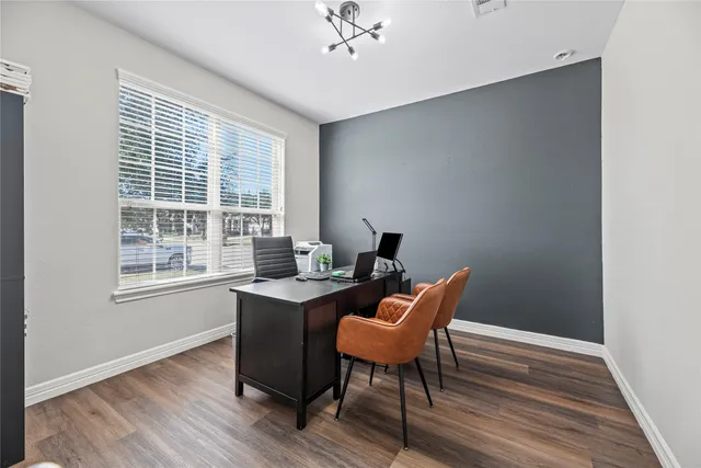 a workspace with wooden floor