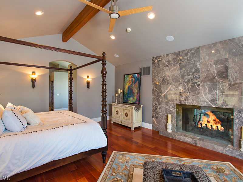 3540 Frost Lane Reno, NV 89511 - Photo 6 of 9 a bedroom with a bed and a fireplace