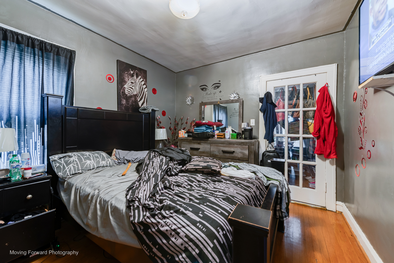8213 South Indiana Avenue Chicago, IL 60619 - Photo 16 of 25 a bedroom with bed and wooden floor