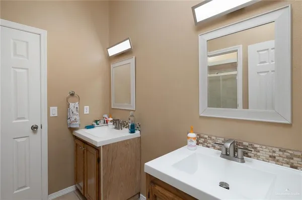 a bathroom with a sink and a mirror