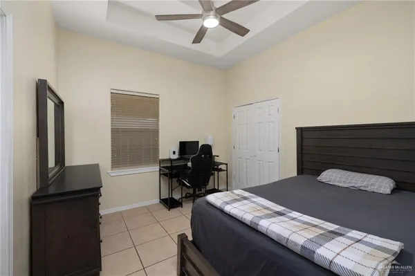 a bedroom with a bed and a piano