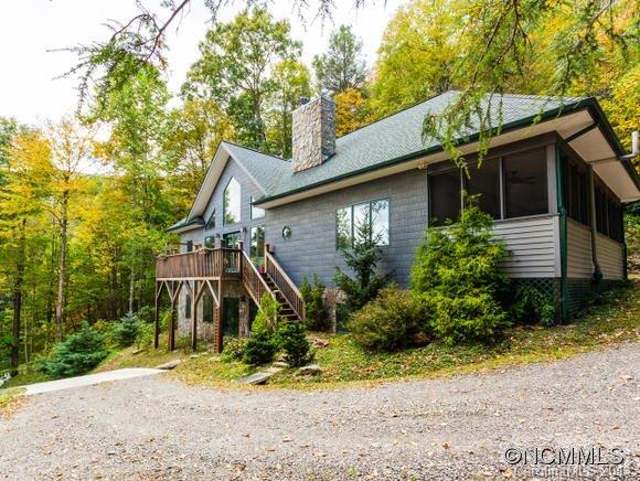 182 Flying Hawk Road Waynesville, NC 28786 - Photo 1 of 24 a view of a house with a yard