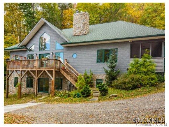 182 Flying Hawk Road Waynesville, NC 28786 - Photo 2 of 24 a front view of a house with a yard