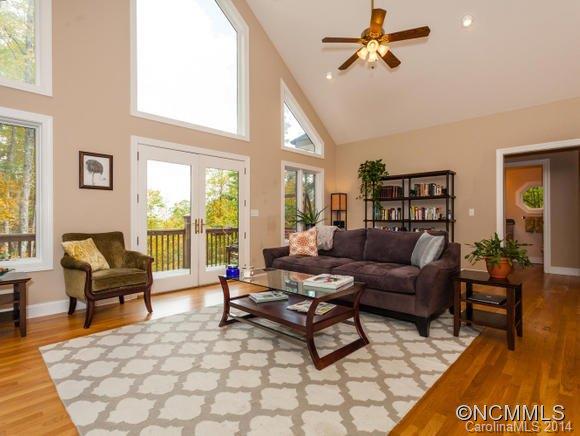 182 Flying Hawk Road Waynesville, NC 28786 - Photo 7 of 24 a living room with furniture and a large window