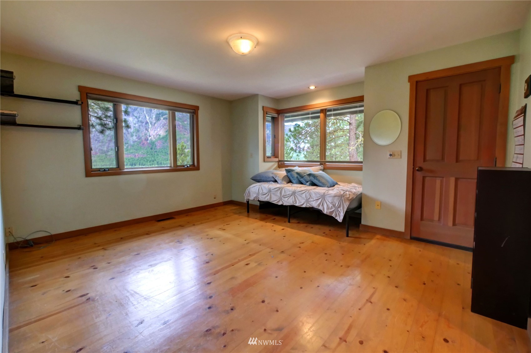17 Cassal Road Winthrop, WA 98862 - Photo 15 of 28 a bedroom with furniture and a window