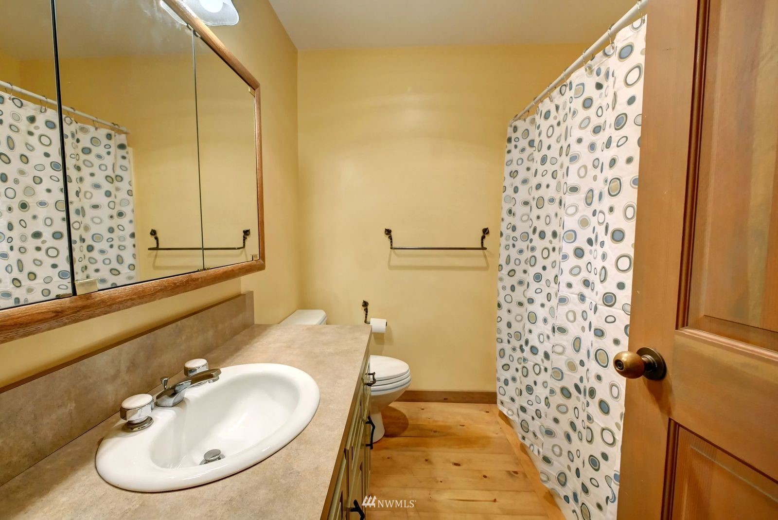 17 Cassal Road Winthrop, WA 98862 - Photo 23 of 28 a bathroom with a sink and a mirror