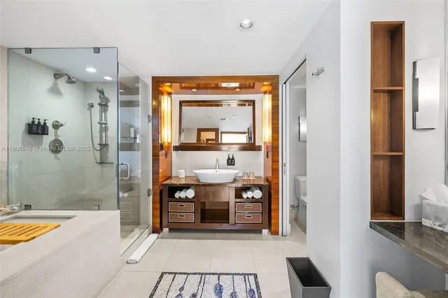 a spacious bathroom with a tub and shower