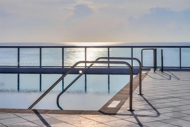 a view of ocean with palm trees