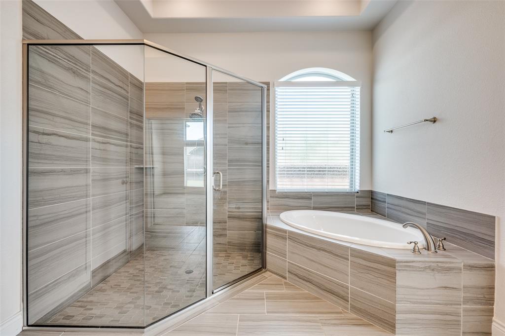 1700 Lithgow Road Celina, TX 75009 - Photo 24 of 40 a bathroom with a granite countertop bathtub shower and sink