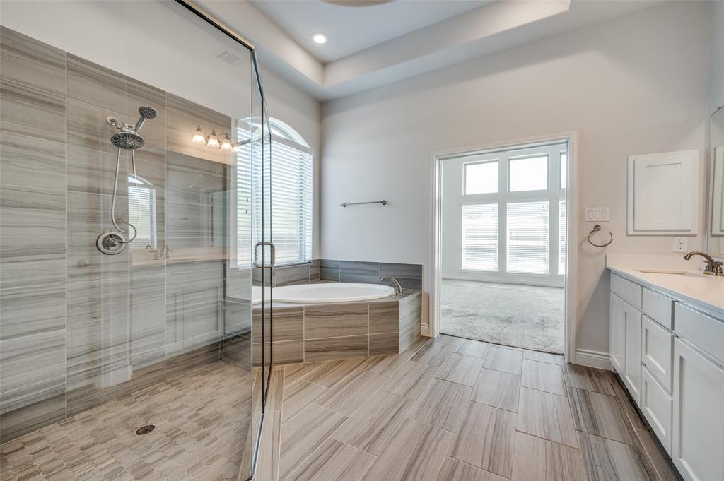 1700 Lithgow Road Celina, TX 75009 - Photo 25 of 40 a spacious bathroom with a tub shower and sink