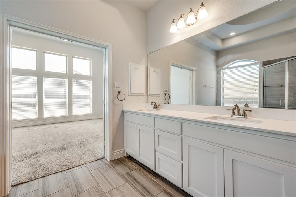 1700 Lithgow Road Celina, TX 75009 - Photo 26 of 40 a en suite bathroom with double vanity and a mirror