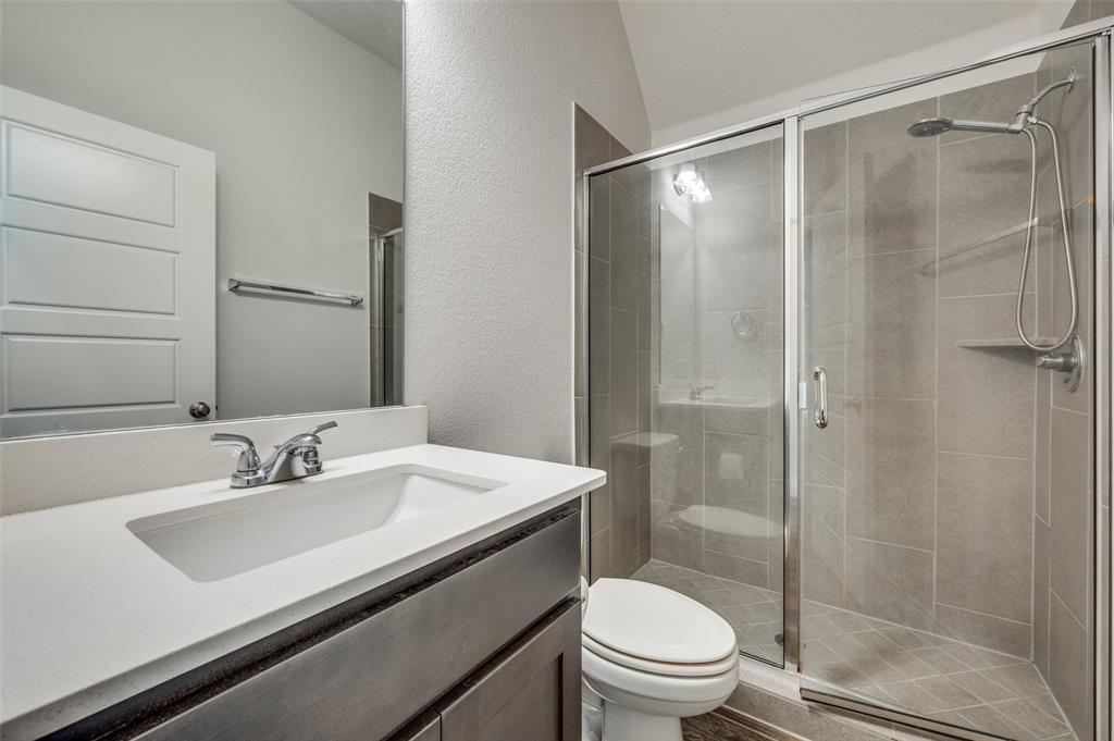 1700 Lithgow Road Celina, TX 75009 - Photo 29 of 40 a bathroom with a sink toilet and shower