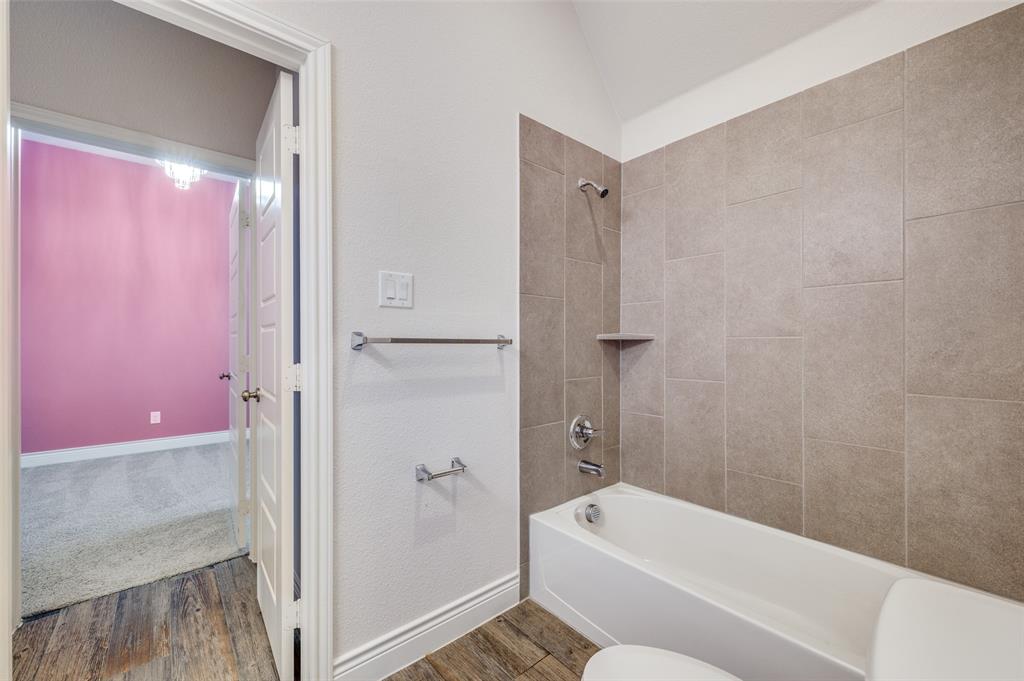 1700 Lithgow Road Celina, TX 75009 - Photo 33 of 40 a bathroom with a tub shower and sink