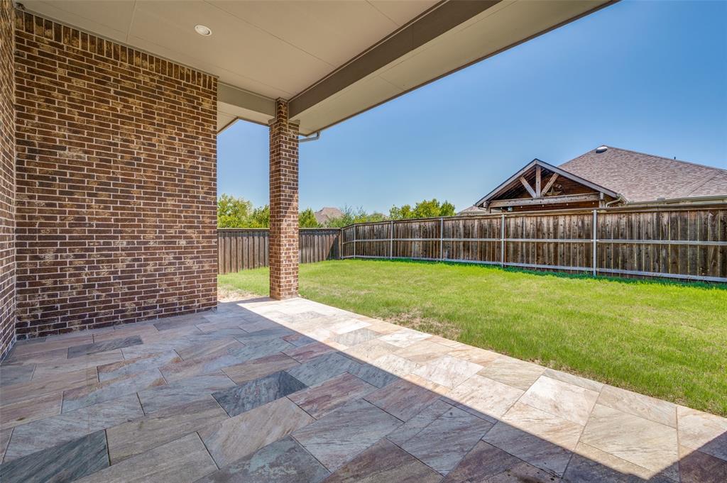 1700 Lithgow Road Celina, TX 75009 - Photo 34 of 40 a view of a yard with a wooden fence