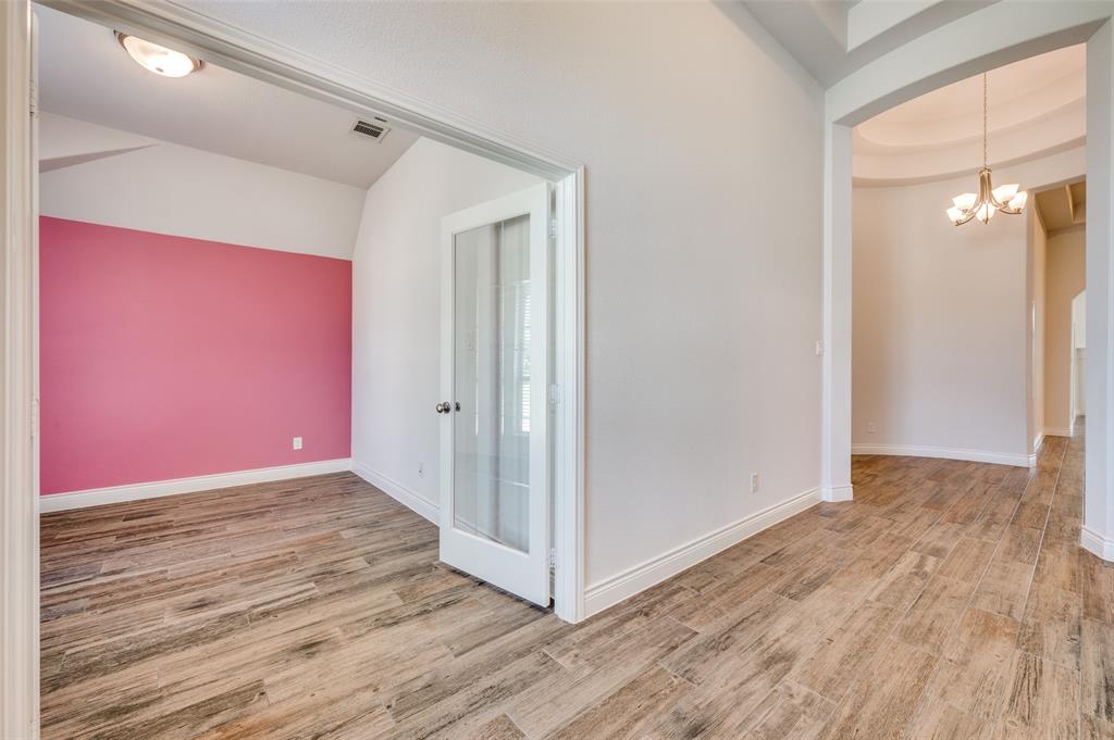 1700 Lithgow Road Celina, TX 75009 - Photo 7 of 40 a view of a hallway with wooden floor