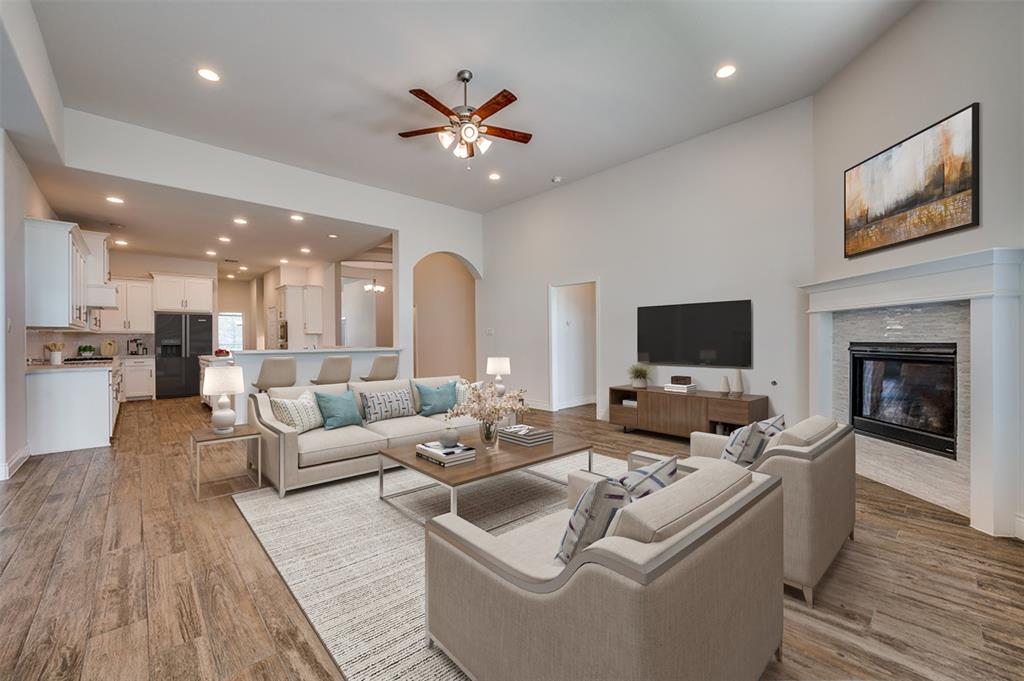 1700 Lithgow Road Celina, TX 75009 - Photo 9 of 40 a living room with furniture and a flat screen tv
