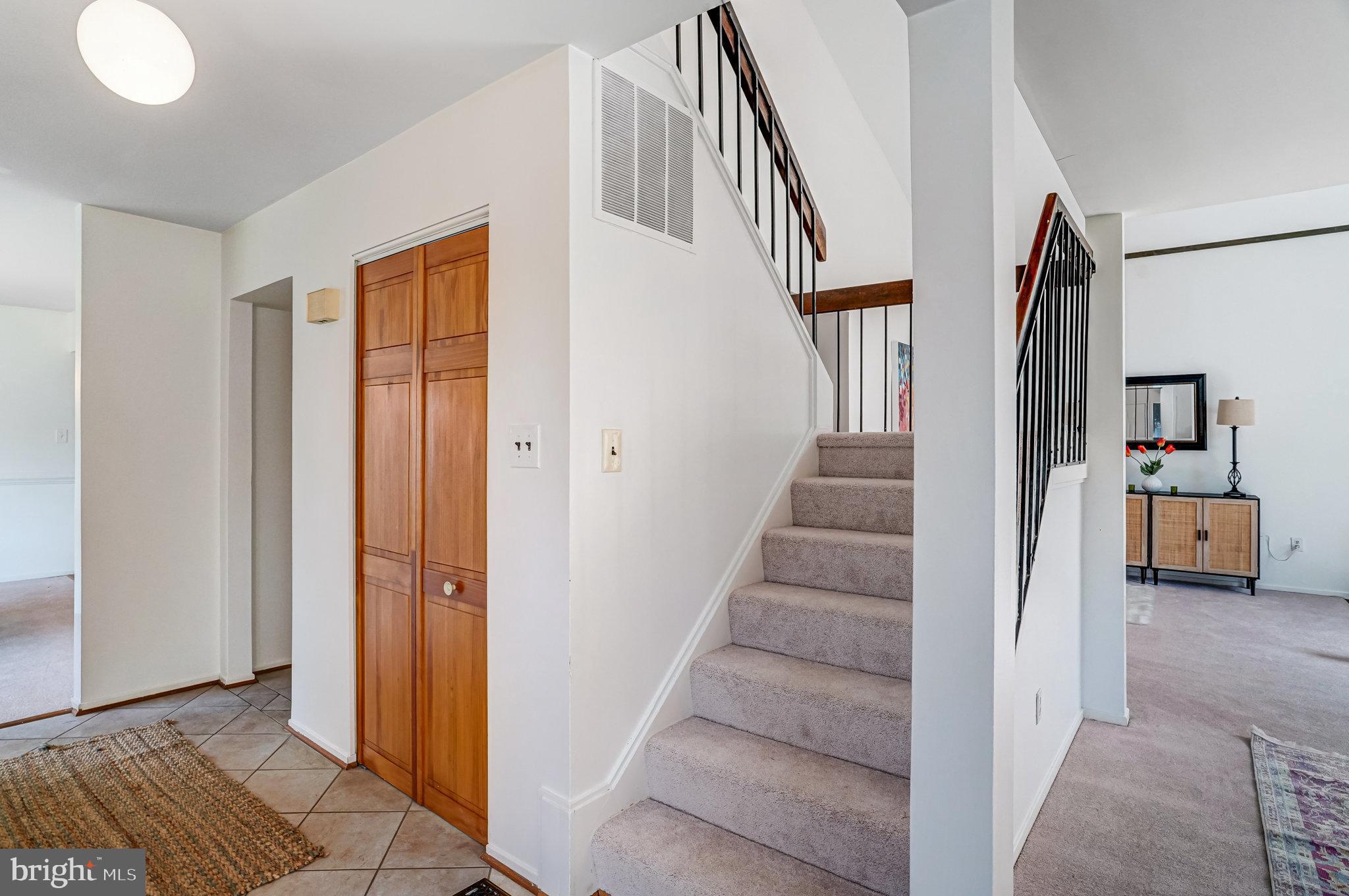 7709 Brandon Way Manassas, VA 20109 - Photo 19 of 40 a view of entryway and hall with wooden floor