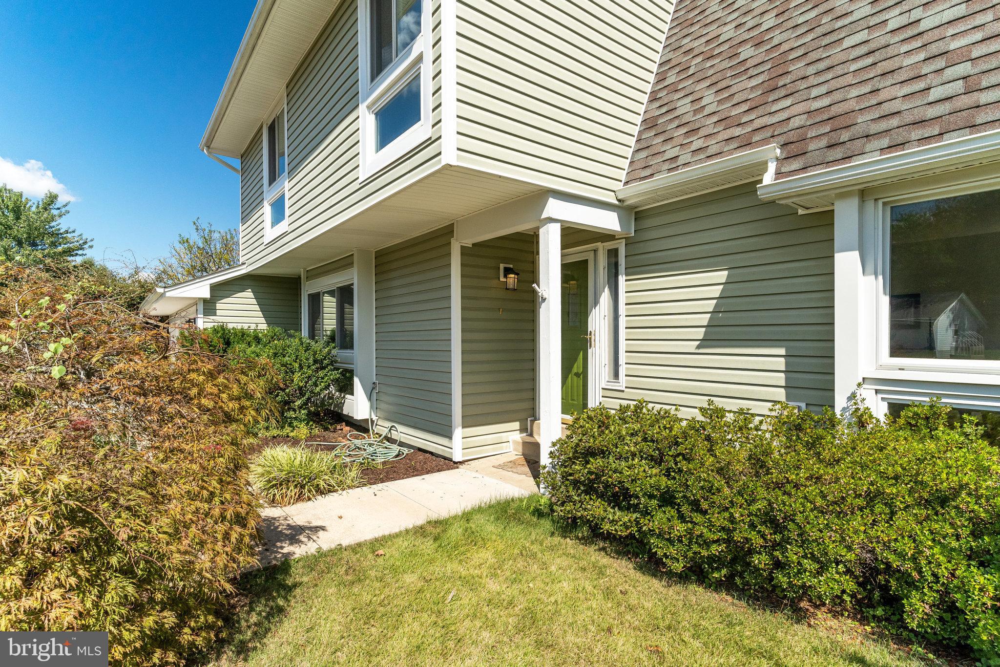 7709 Brandon Way Manassas, VA 20109 - Photo 2 of 40 front view of a house with a yard