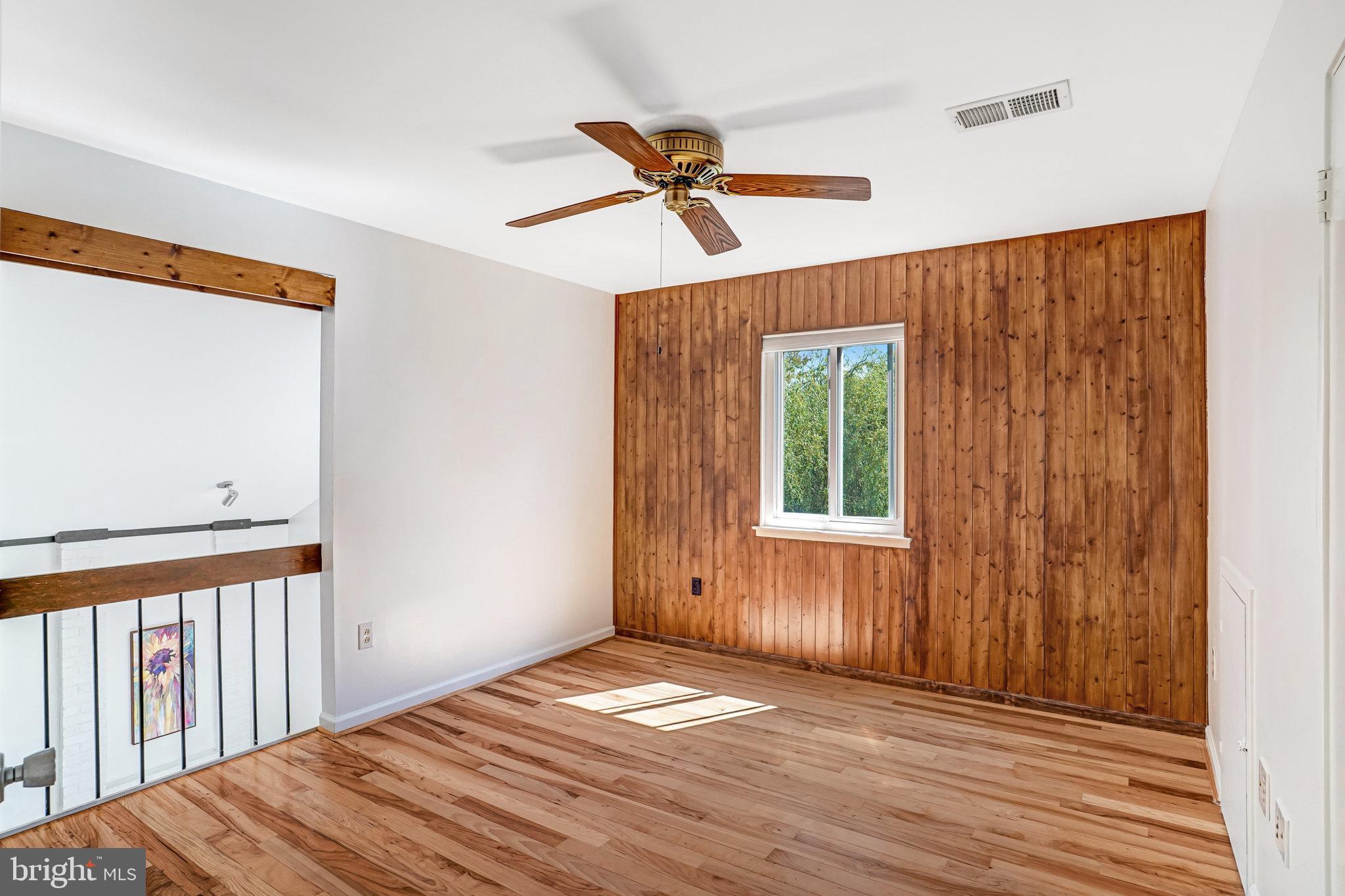 7709 Brandon Way Manassas, VA 20109 - Photo 22 of 40 a view of a livingroom with a window and wooden floor