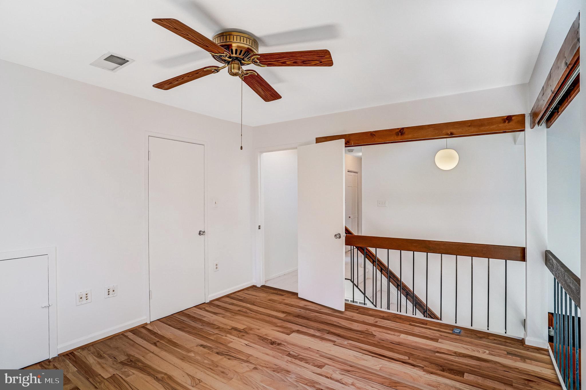 7709 Brandon Way Manassas, VA 20109 - Photo 23 of 40 a view of empty room with wooden floor