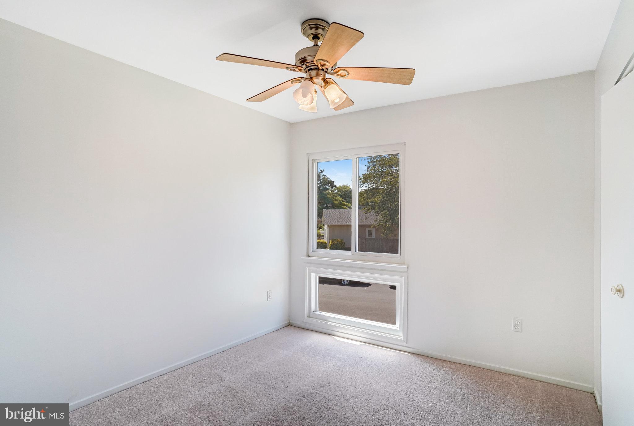 7709 Brandon Way Manassas, VA 20109 - Photo 24 of 40 an empty room with a window and a ceiling fan