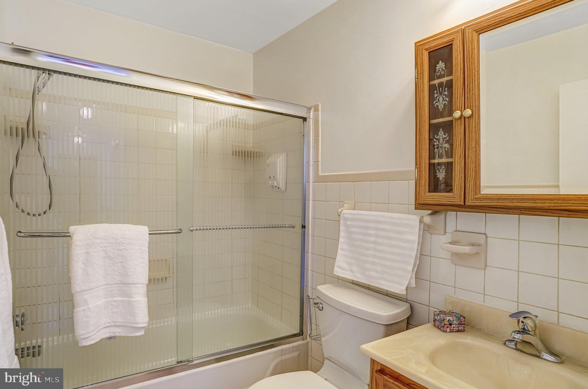 7709 Brandon Way Manassas, VA 20109 - Photo 27 of 40 a bathroom with a shower and a sink