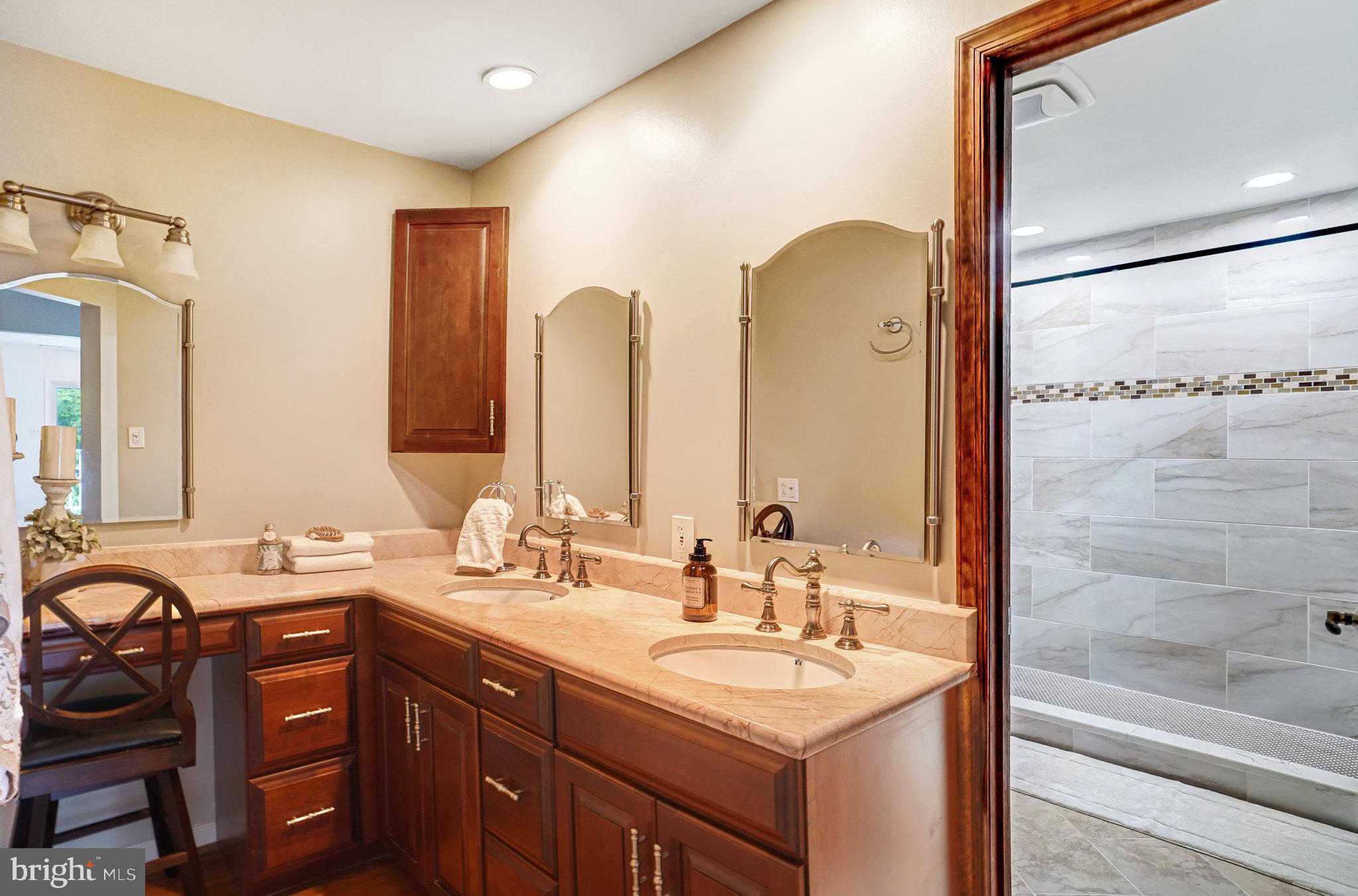 7709 Brandon Way Manassas, VA 20109 - Photo 29 of 40 a bathroom with a double vanity sink and a mirror