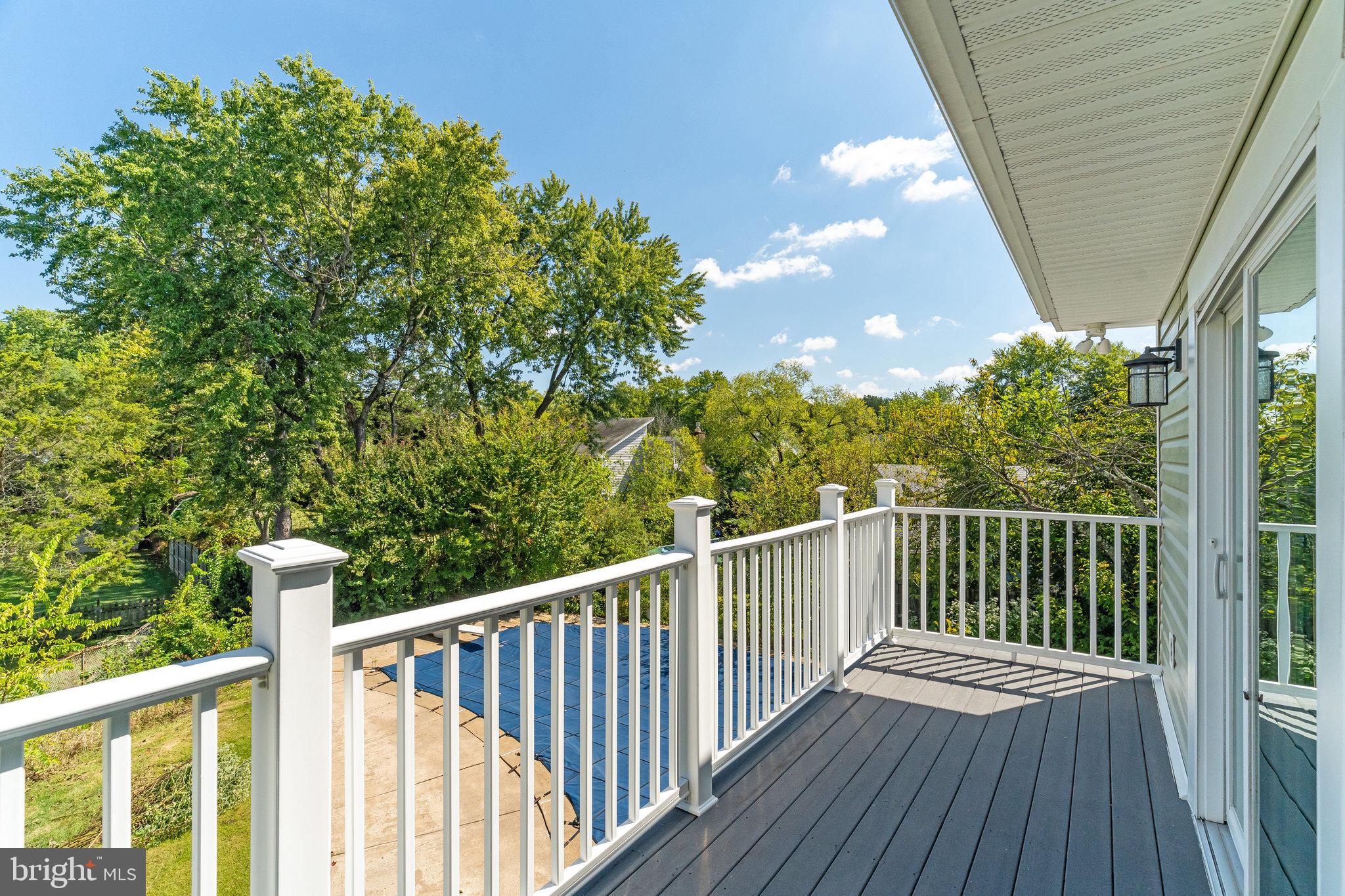 7709 Brandon Way Manassas, VA 20109 - Photo 35 of 40 a view of balcony with wooden floor and fence