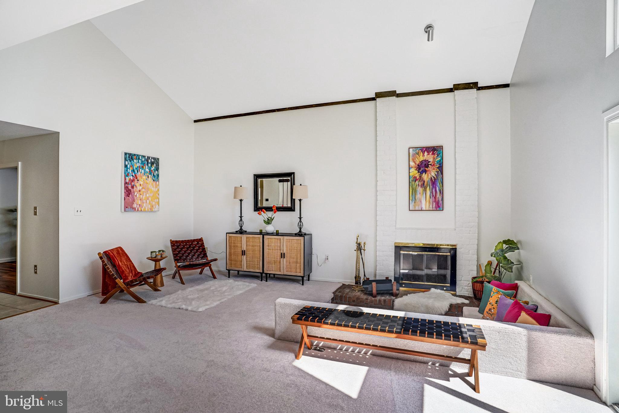 7709 Brandon Way Manassas, VA 20109 - Photo 4 of 40 a living room with furniture gym equipment and a fireplace