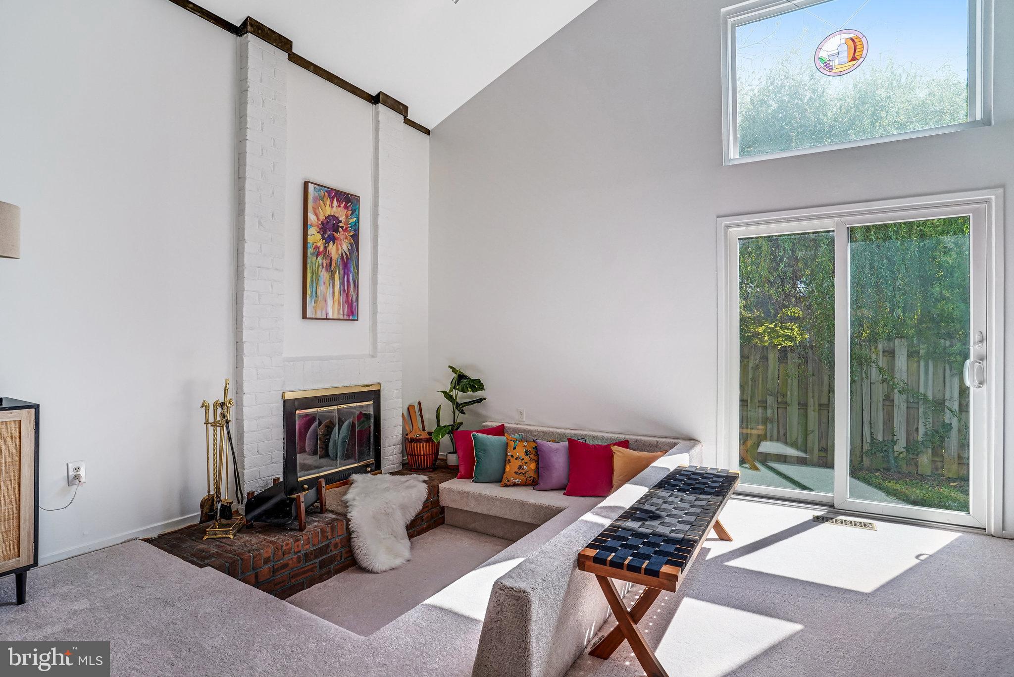 7709 Brandon Way Manassas, VA 20109 - Photo 7 of 40 a living room with furniture and a fireplace