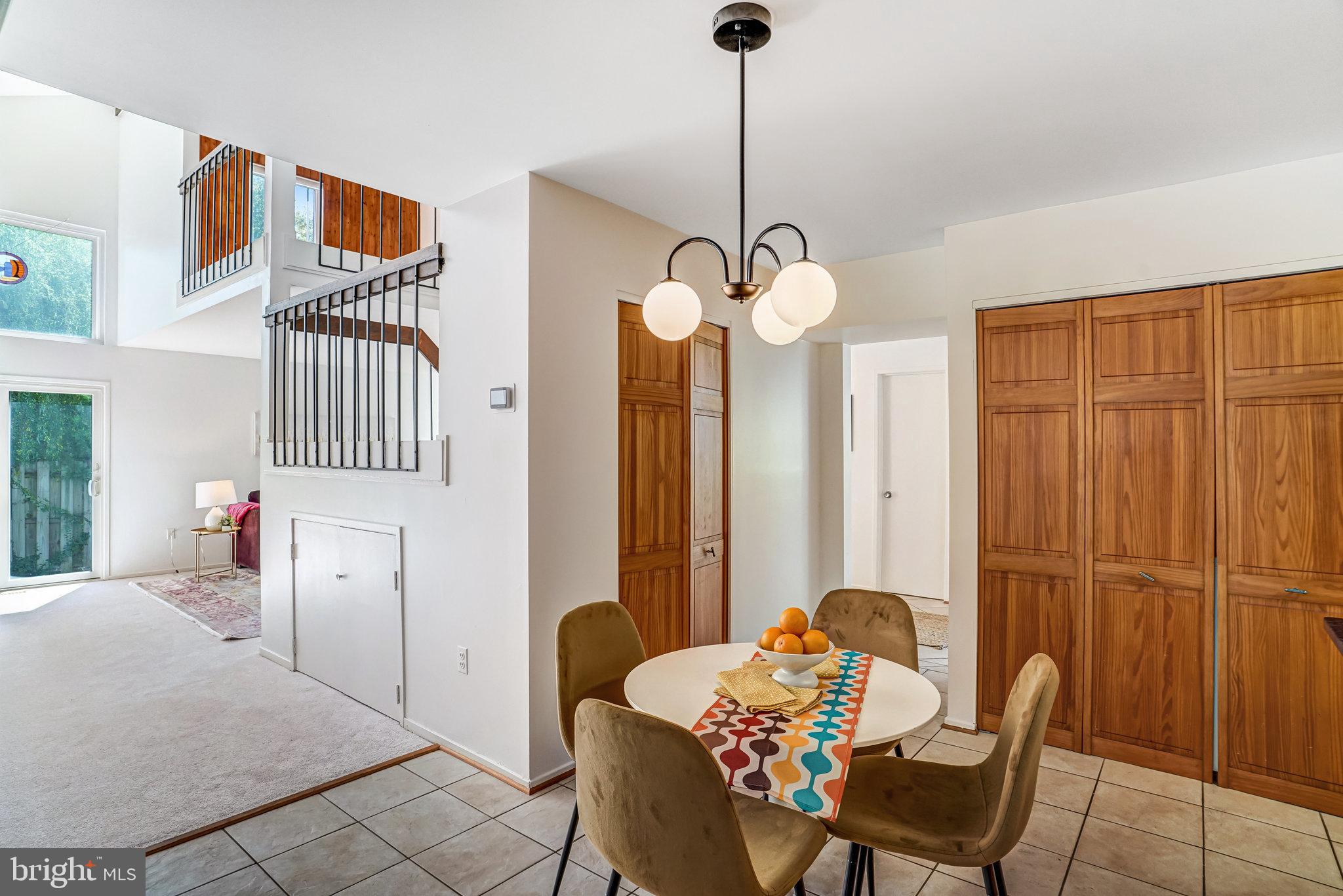 7709 Brandon Way Manassas, VA 20109 - Photo 10 of 40 a living room with furniture and a chandelier